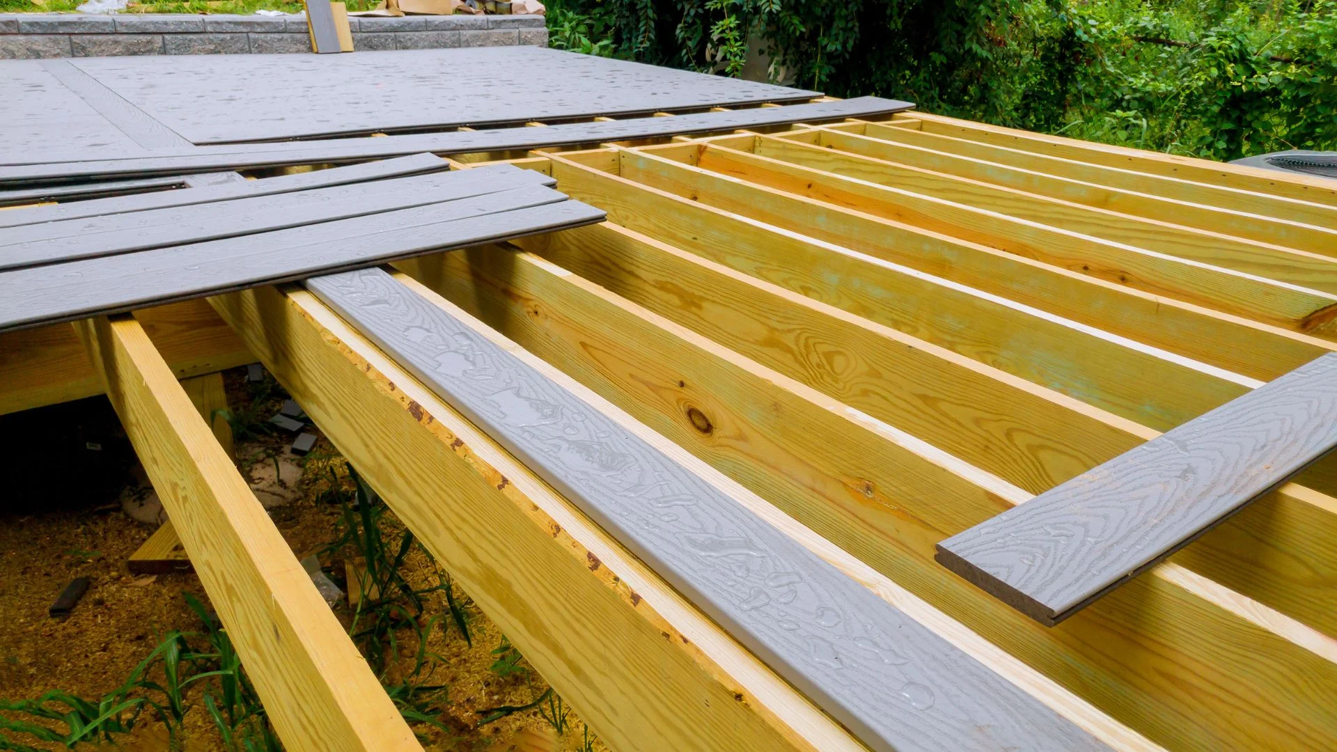 Completed Trex composite deck installation on a backyard in San Antonio, TX