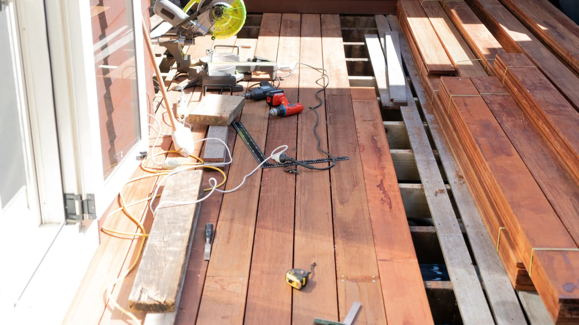 Paradise Decks & Spas crew replacing damaged deck boards on a backyard deck in Stone Oak, San Antonio