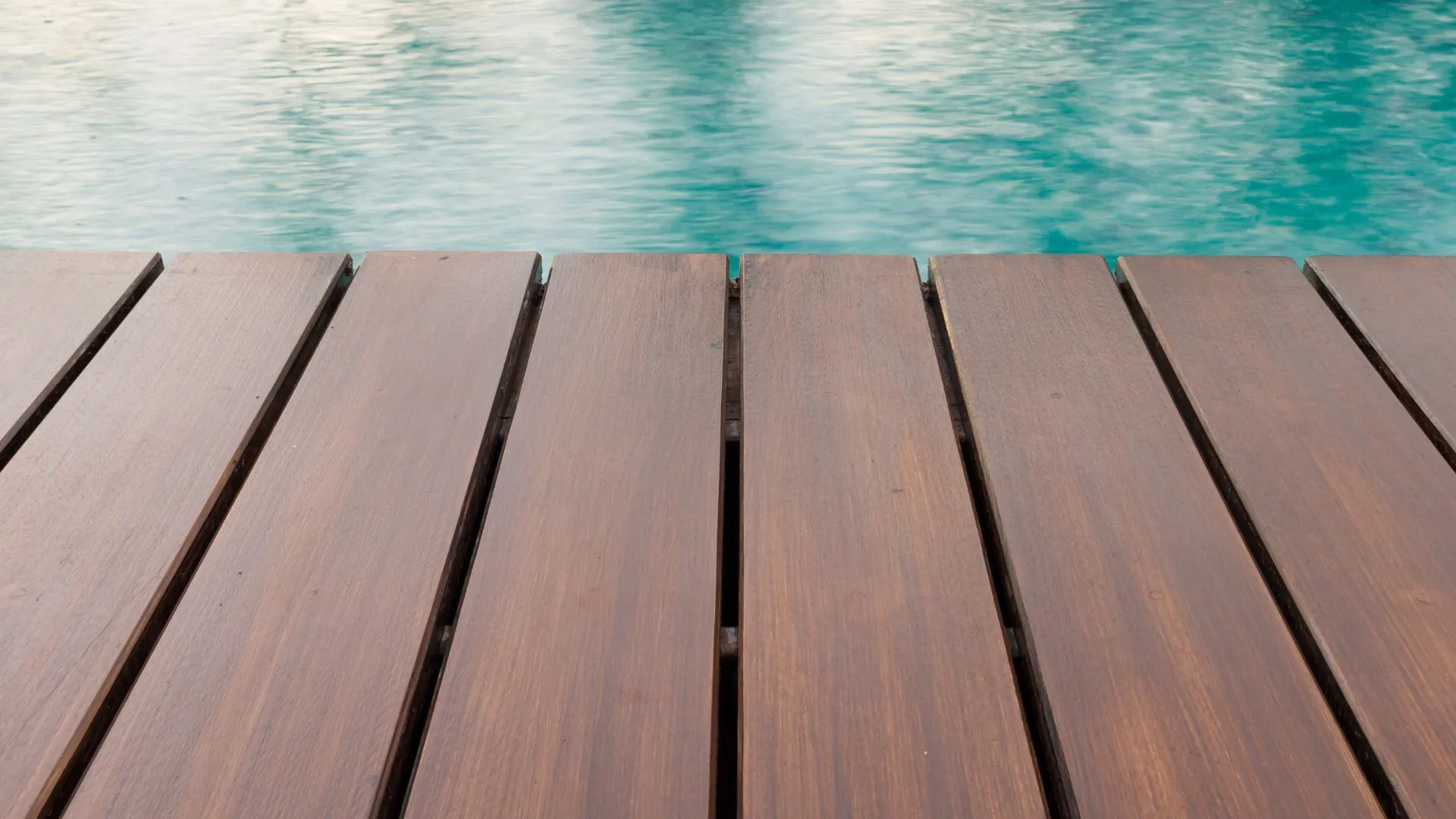 Above ground pool with deck wrapping one side at a north San Antonio home