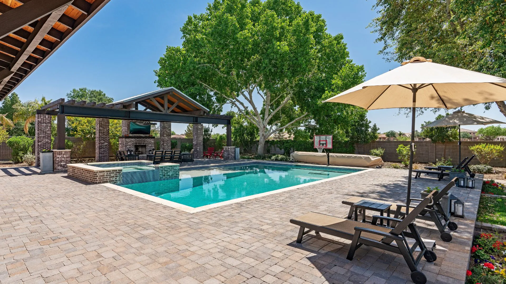 Light broom finish concrete pool surround at a Stone Oak home in San Antonio