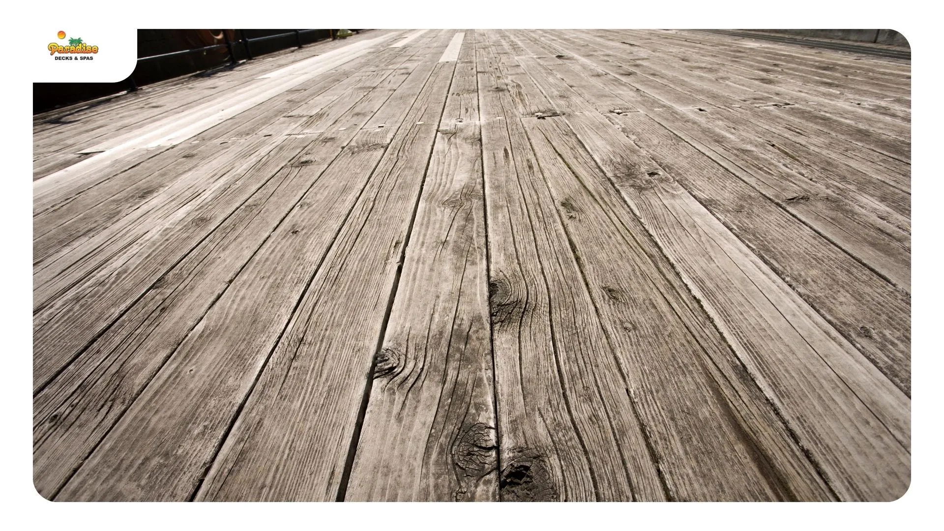 Concrete deck footing with rusted post base hardware on a Stone Oak deck rebuild