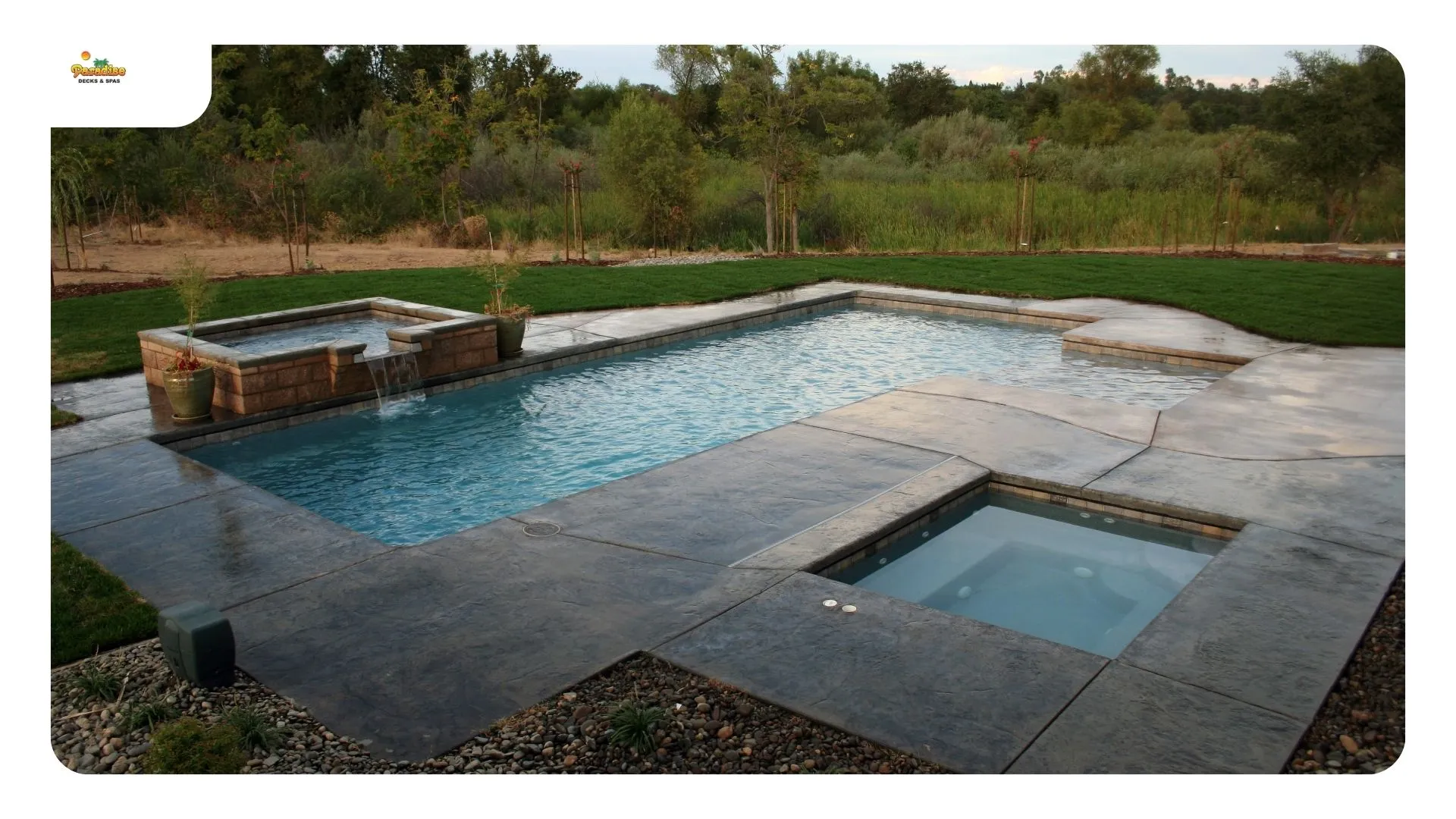 Stamped concrete pool surround in a light tone at a north San Antonio home